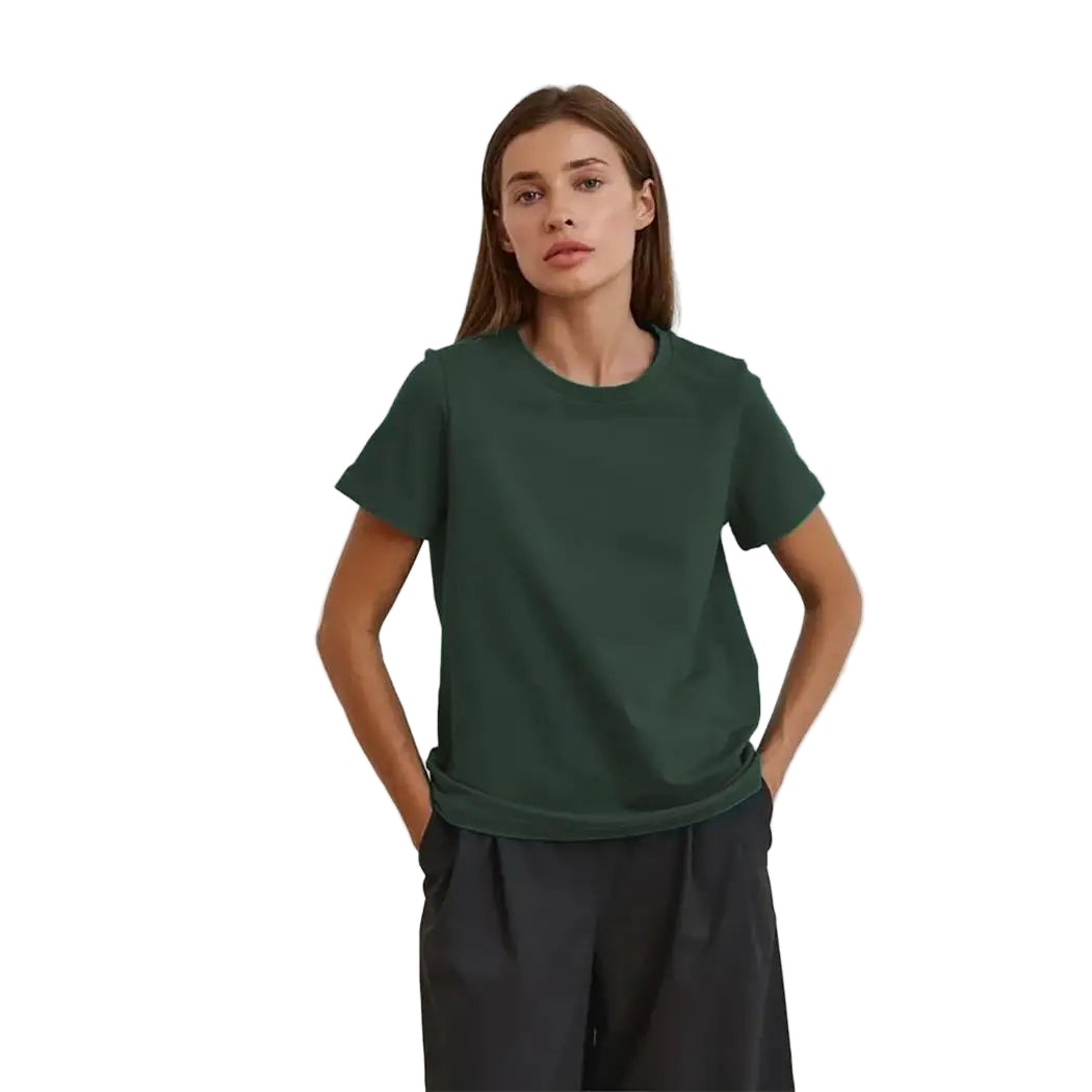 Person wearing a green t-shirt and black pants against a plain background